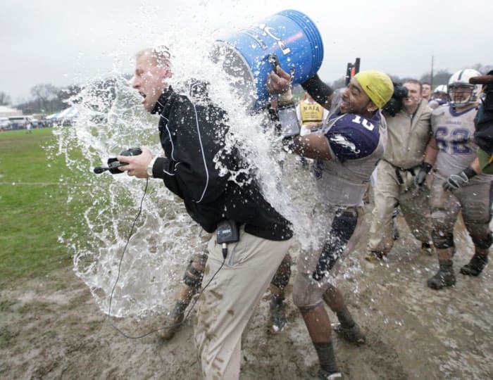 Brown Jr. douses DeBoer in an ice bath after defeating Van Diest's Carroll College in the 2008 Division-II National Championship game.